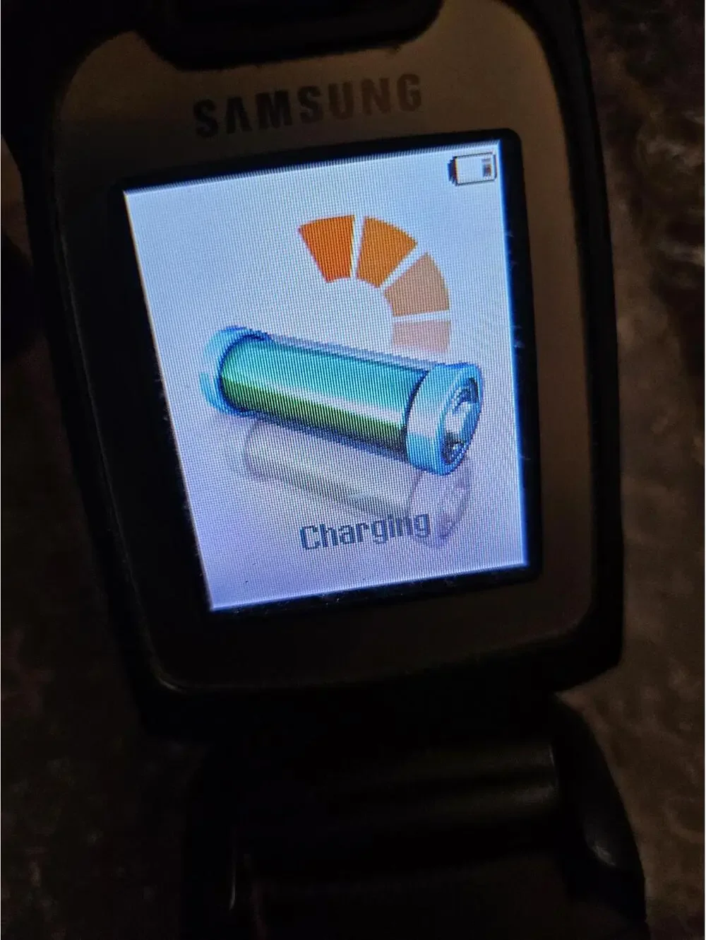 Nice vintage Samsung flip cell phone t-mobile. With Charger. Powers on & charges